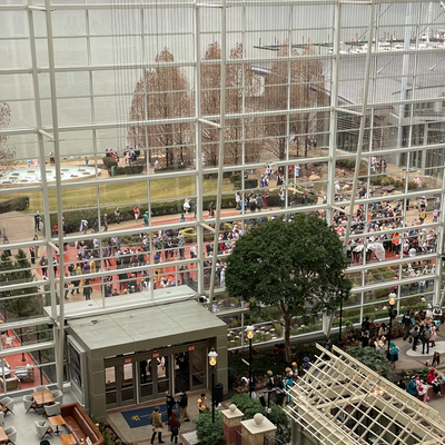 A cosplay meetup fills the garden just outside the atrium.