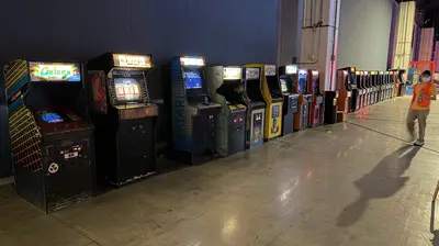 Vintage arcade games line the hall